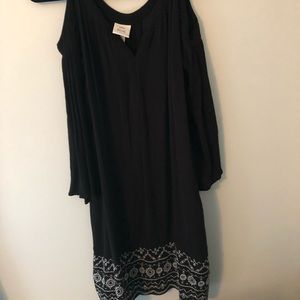 Woman’s cold shoulder black dress